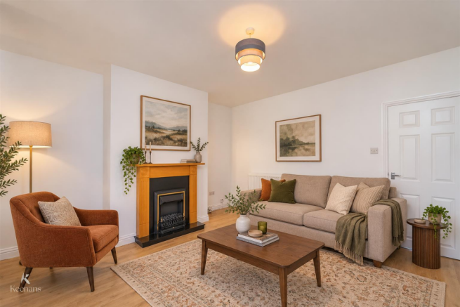 Warm contemporary living room with fireplace.png