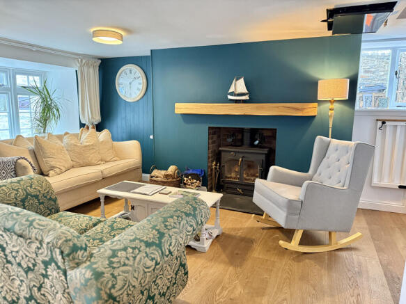 Cosy sitting room with log burner