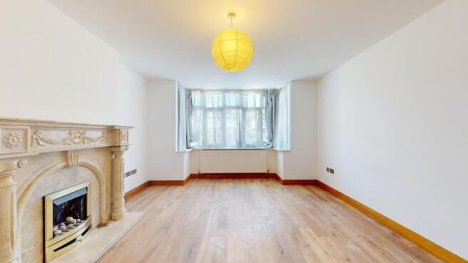 Bright lounge with a feature fireplace....