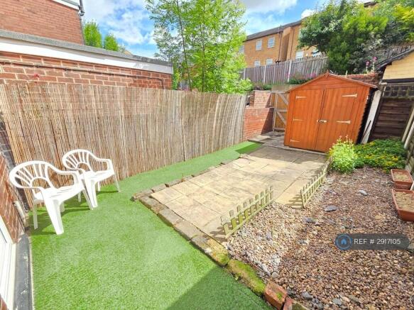 Gravel And Faux Grass Garden
