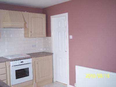 Kitchen showing walk in storage cupboard
