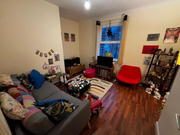 Cosy, characterful living room with a comfortab...