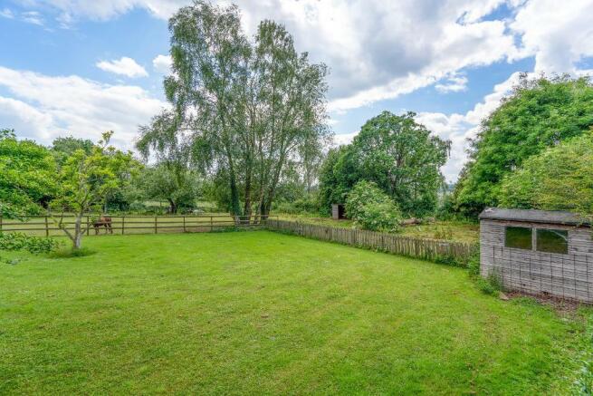 Paddock and gardens to the front