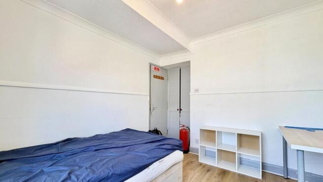 Bright bedroom with ample storage and desk area...