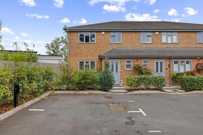 Front of house and parking spaces