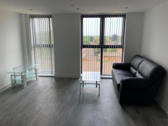 Bright modern lounge with balcony view...