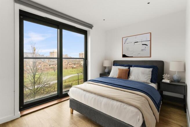 Experience tranquility in this elegantly designed bedroom with splendid outdoor views.