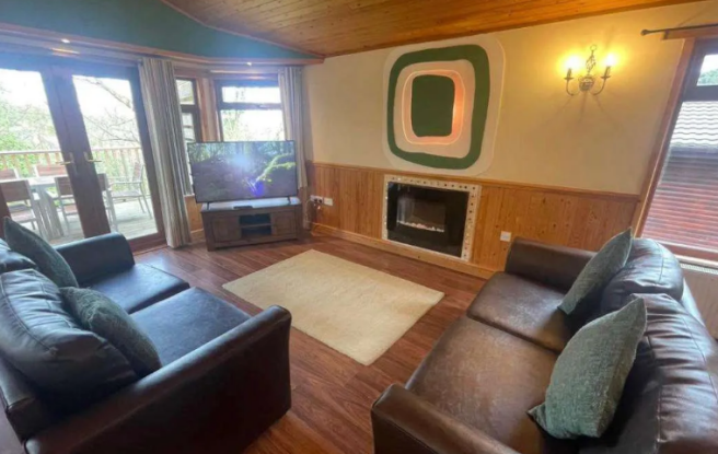 Spacious living room with open plan layout at Wate