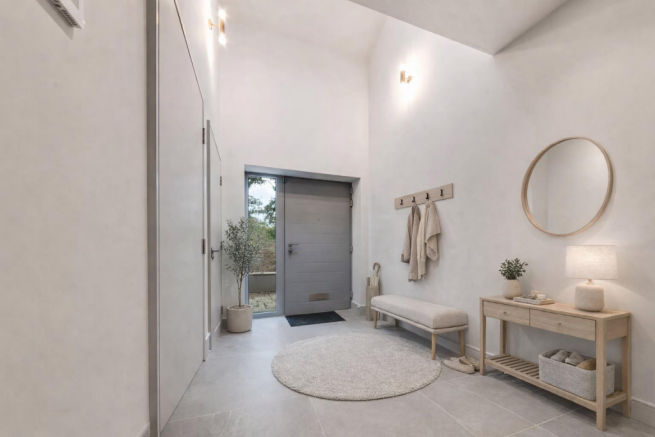 Modern minimalist entryway with olive tree.png