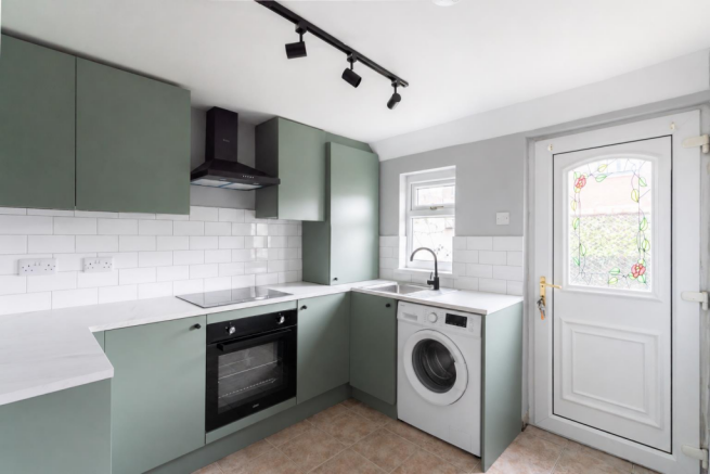 Sage Green Kitchen with Washing Machine.png