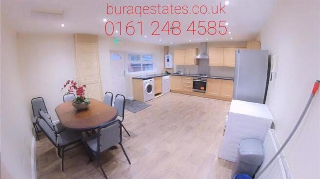 Bright, open-plan kitchen with integrated appli...