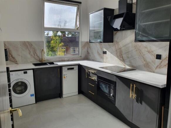Sleek modern kitchen with integrated appliances...