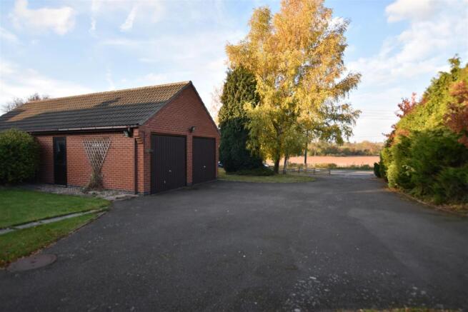 EXTENSIVE DRIVE AND GARAGE
