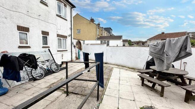 Spacious sun-soaked patio with picnic seating...