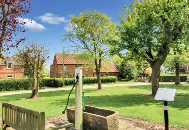 Village Green & Front Elevation.JPG