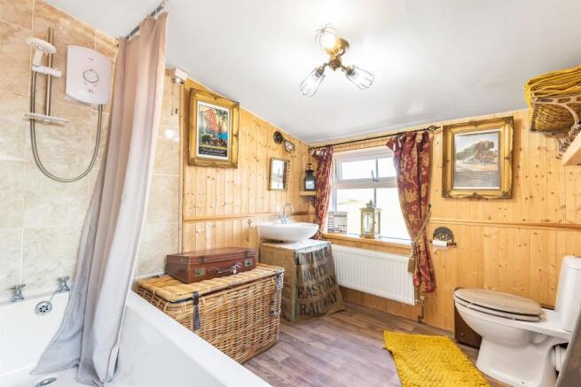 Bathroom with separate shower over