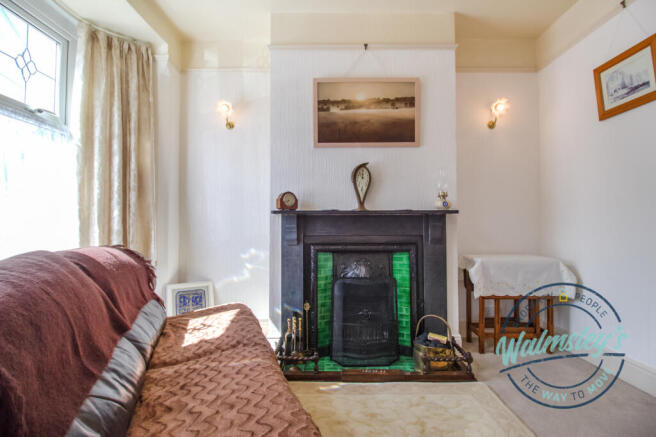 Front sitting room with bay & real fire