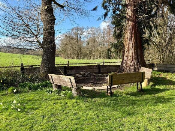 Summer fire pit overlooking fields