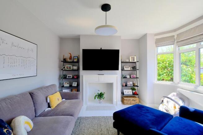 Welcoming sitting room with bay window