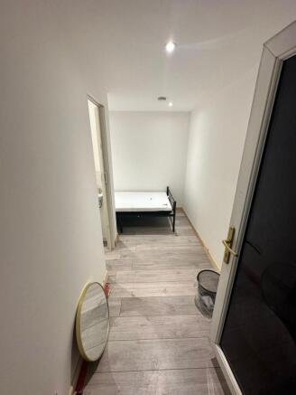 Bright bedroom with modern wood-effect flooring...