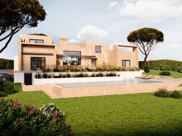Modern contemporary villa exterior with private swimming pool and landscaped gardens in Salicos Carvoeiro Algarve.