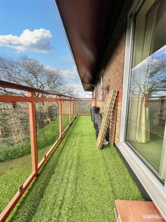 Private balcony with artificial lawn and views...