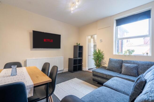 Bright, modern living room with a comfortable L...