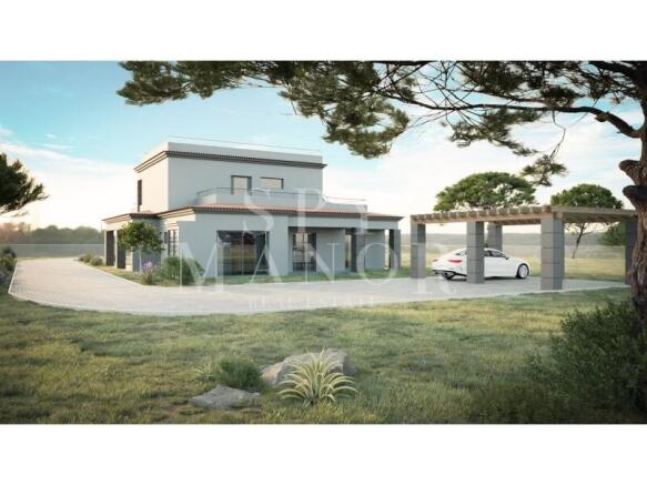 Modern luxury villa exterior in Vale del Rei, Carvoeiro, featuring a spacious paved driveway, covered car port structure, and lush green landscaping under a clear sky.