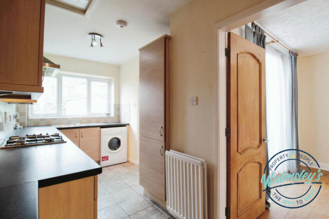 Kitchen with door to dining room