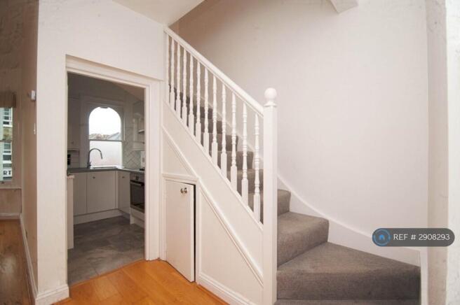 Hallway View To Kitchen And Stairs
