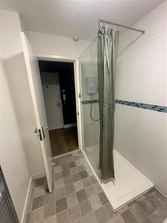 Bright bathroom with a large walk-in shower...