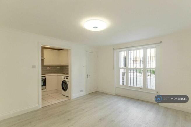 Living Room With View Of The Kitchen