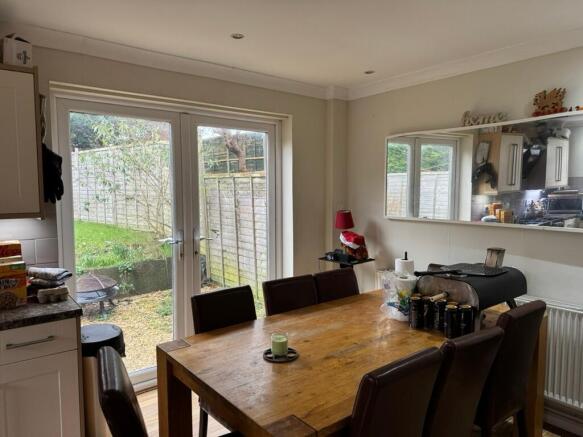Bright kitchen-diner with large patio doors ope...