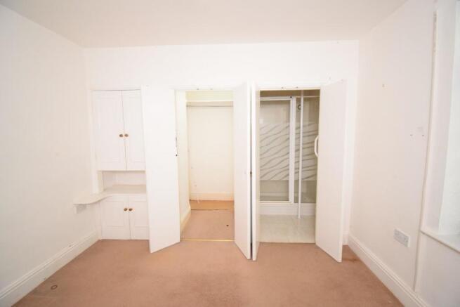 Bed 3 showing walk in wardrobe and shower.JPG