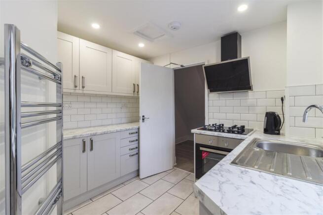 Modern kitchen with sleek white cabinets....