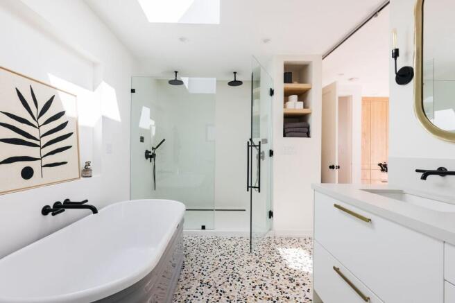 A modern and clean bathroom featuring a bath an...