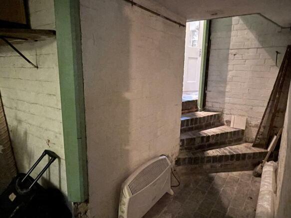 Stairs to cellar, can access from rear