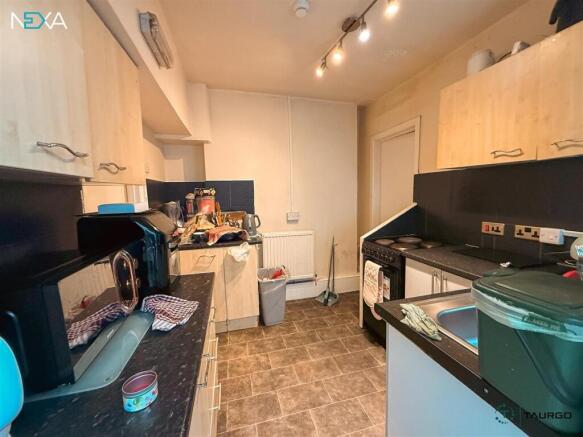 Bright kitchen with ample storage and workspace...
