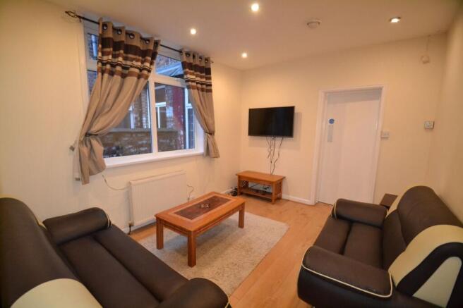 A bright and inviting living room featuring two...