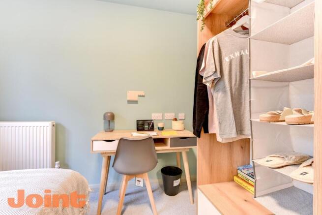 Bright workspace with modern desk and storage...