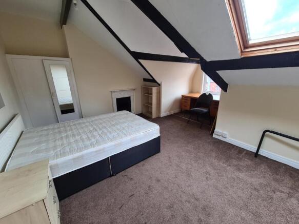 Spacious attic double bedroom with sloped ceili...