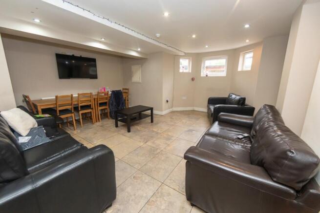 Spacious and well-lit contemporary living room ...