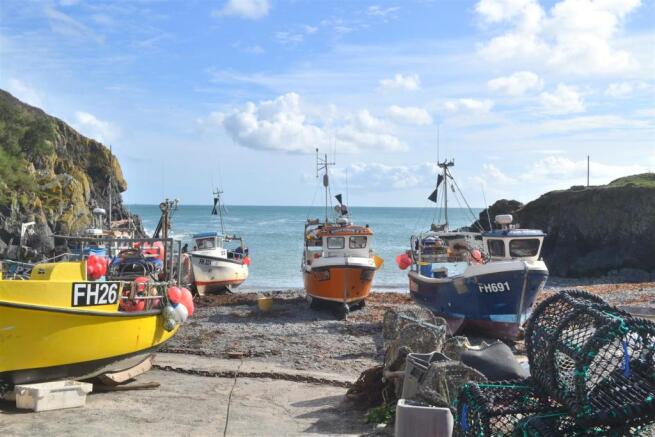 Nearby boats on beach.JPG