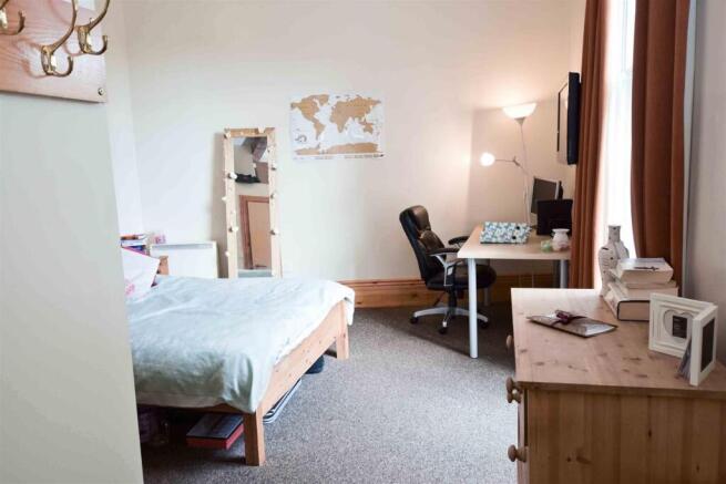 Bright bedroom with dedicated study workspace...