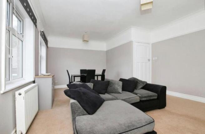 This inviting living room features ample space ...