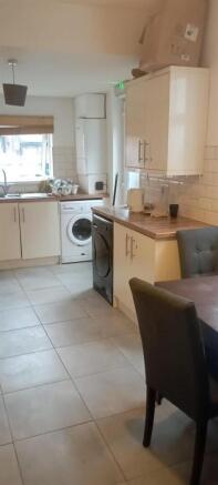 Bright kitchen with modern units and dining spa...