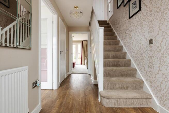 The central hallway with under stairs storage