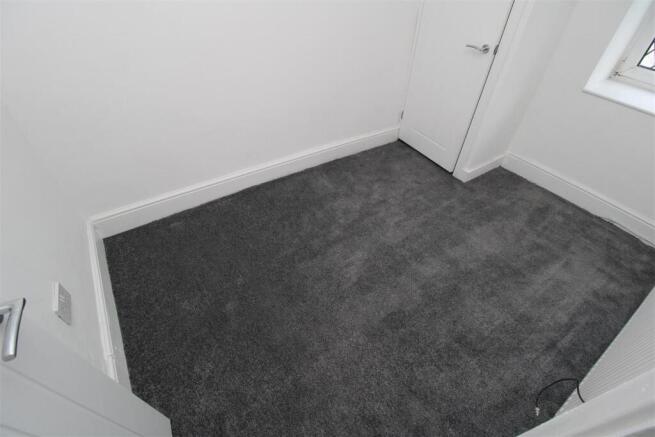 Bright modern room with plush grey carpet...