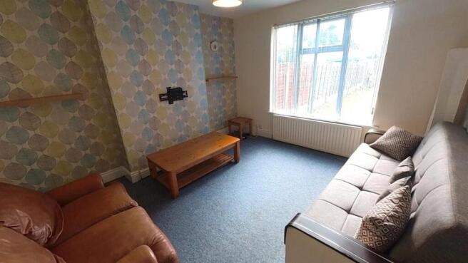 Bright lounge with feature wall and comfy sofas...