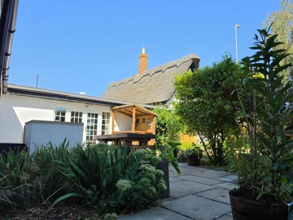 Thatch Cottage Summer Patio.jpg